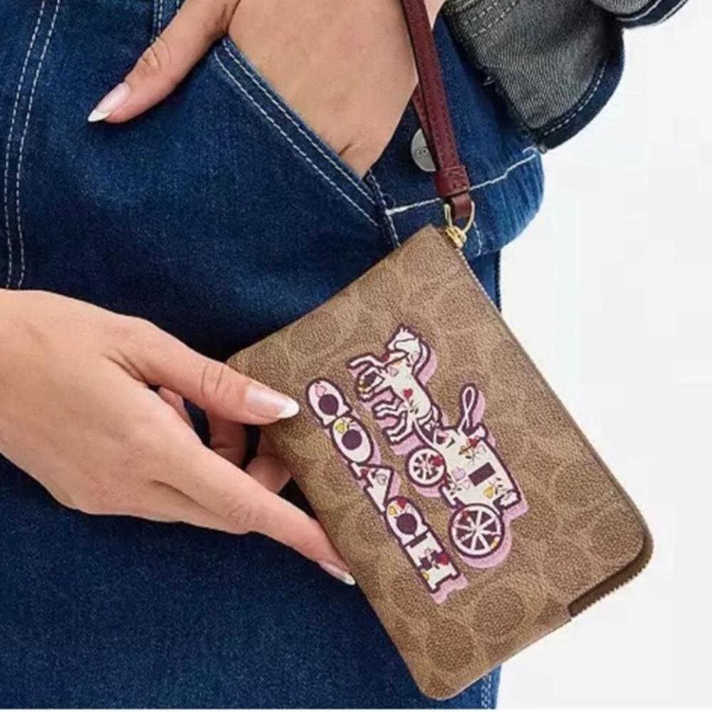 Coach Corner Zip Wristlet In
Signature Canvas With Horse And Carriage Print